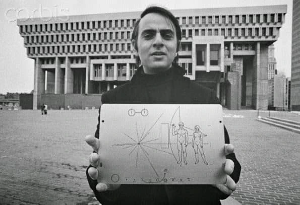 Carl Sagan holding the Pioneer Plaque
